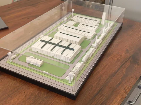 Industrial site model on a table with a clear display cover